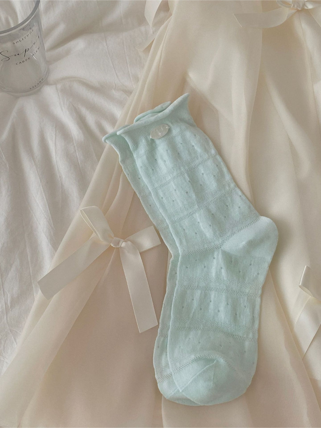 Rufia mesh dot mid-calf socks worn with shoes, showing sheer fabric and dot details