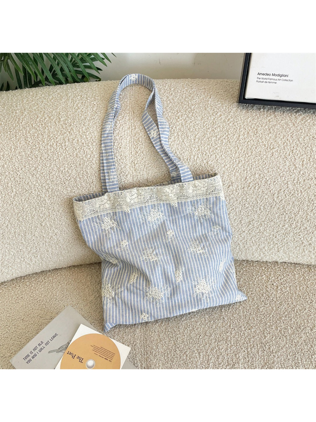 Side view of Cosbai Lace Floral Stripe Tote Bag showing handle and lace details