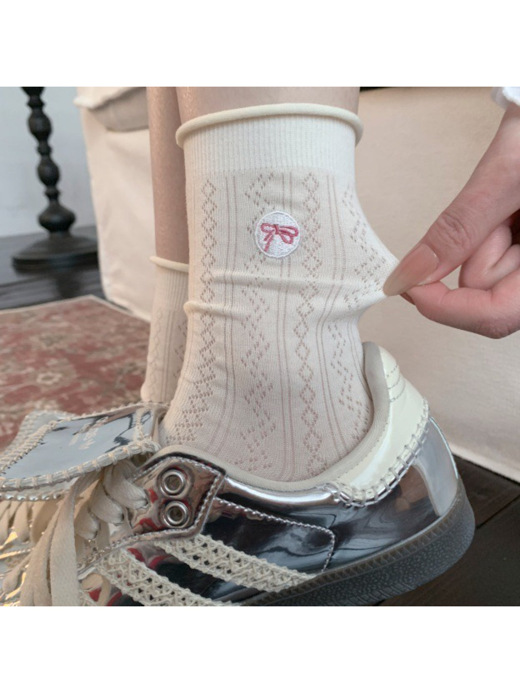 Close-up of Rufia casual bow knit sock showing textured knit pattern and bow detail