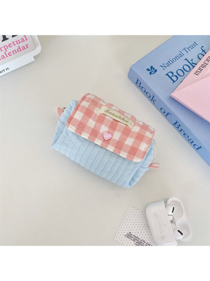 Cosbai cosmetic pouch folded flat to show flexibility of quilted material