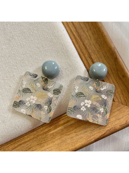 Earwish Botanical Square Drop Earrings worn on a model's ear