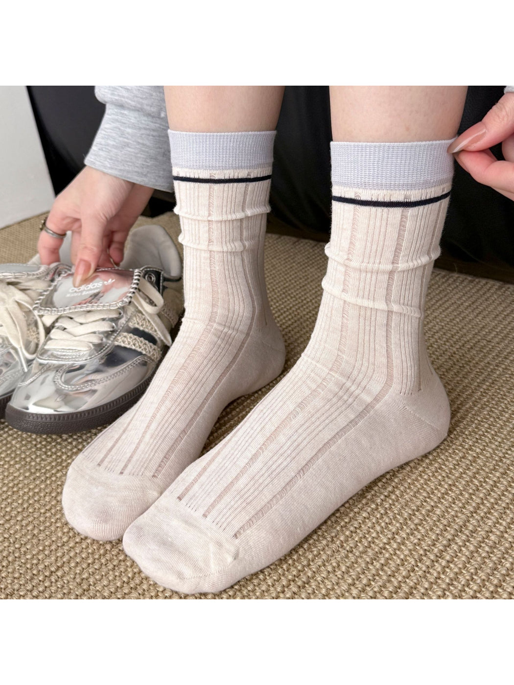 Side view of Rufia contrast stripe ribbed crew socks highlighting fabric texture