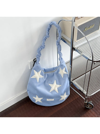 Back view of beige Cosbai slouchy shoulder bag with star patch