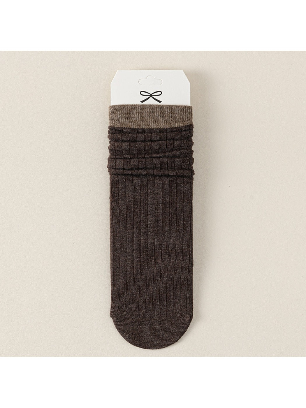 Three pairs of Rufia ribbed mid-calf socks in beige, gray, and black arranged side by side
