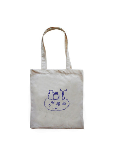 Cosbai tote bag held by a model, showing size and strap length