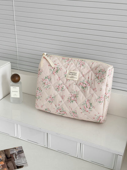 Close-up of Cosbai floral quilted travel organizer bag showing and