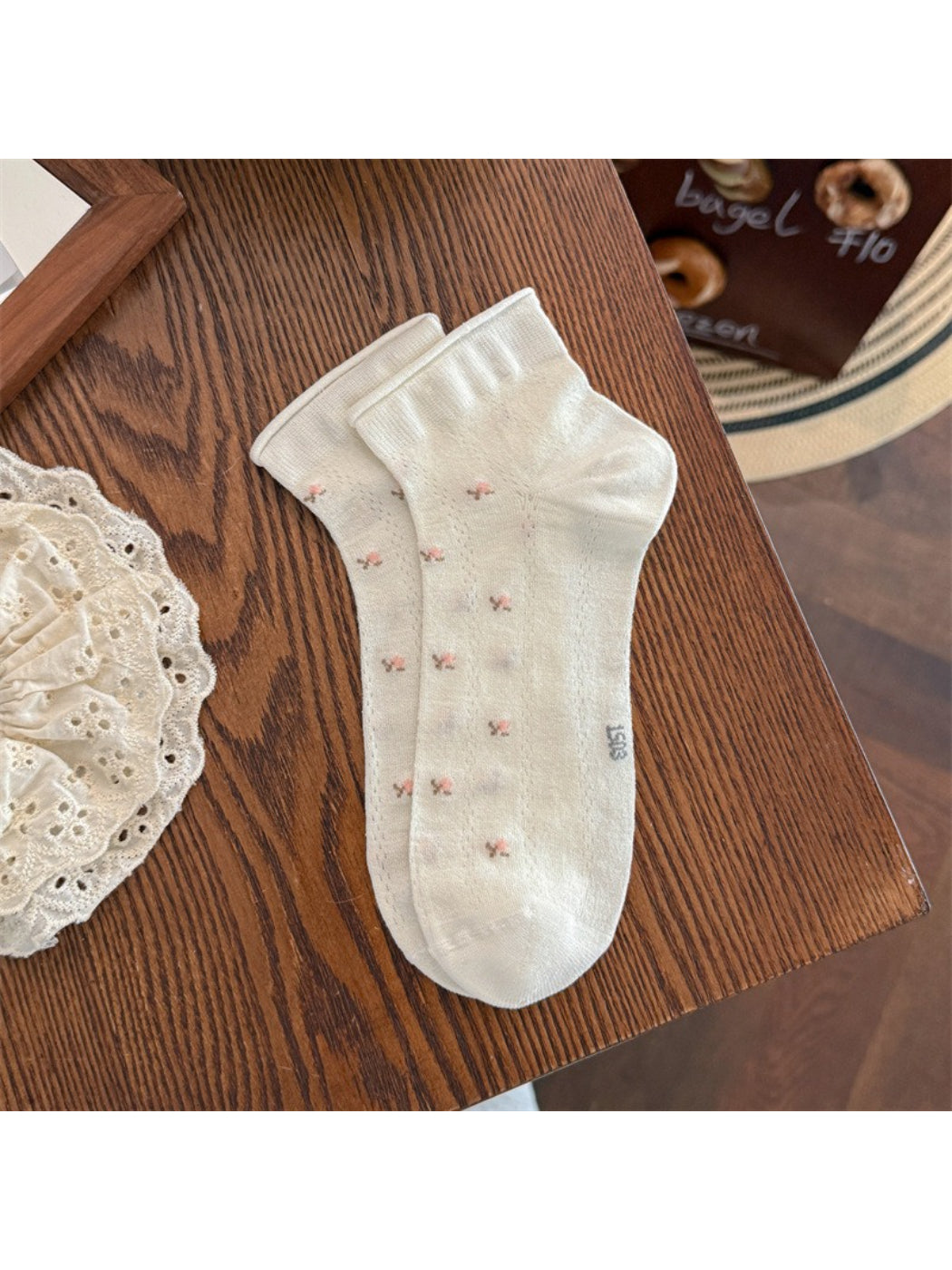 Close-up of Rufia sock heel and toe area with subtle flower design