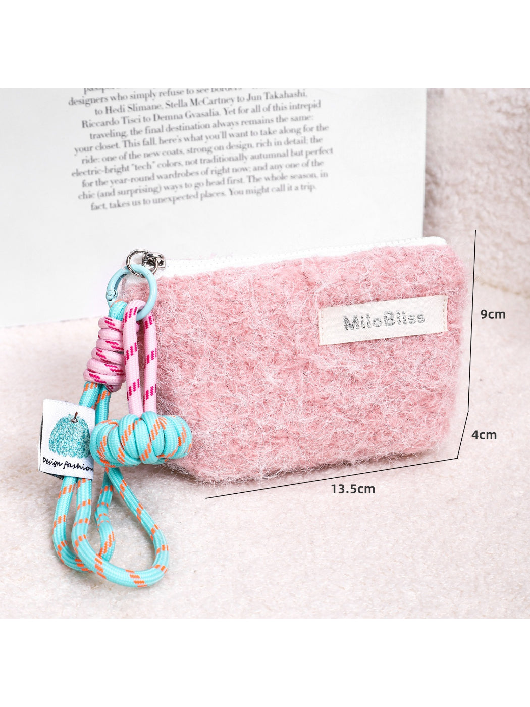 Cosbai fluffy mini pouch held by hand showing size and wrist cord