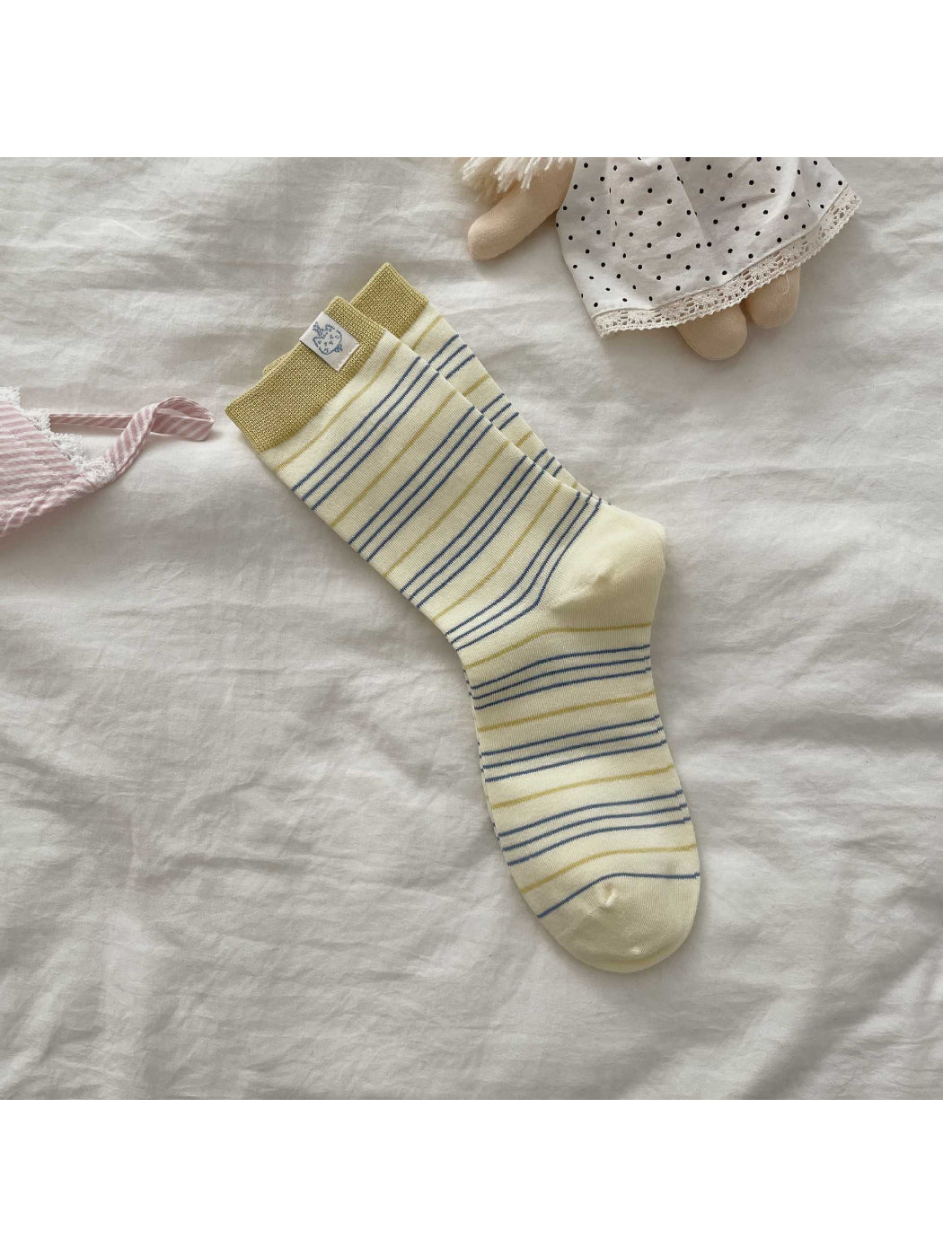 Side view of Rufia socks highlighting patch and stripe texture