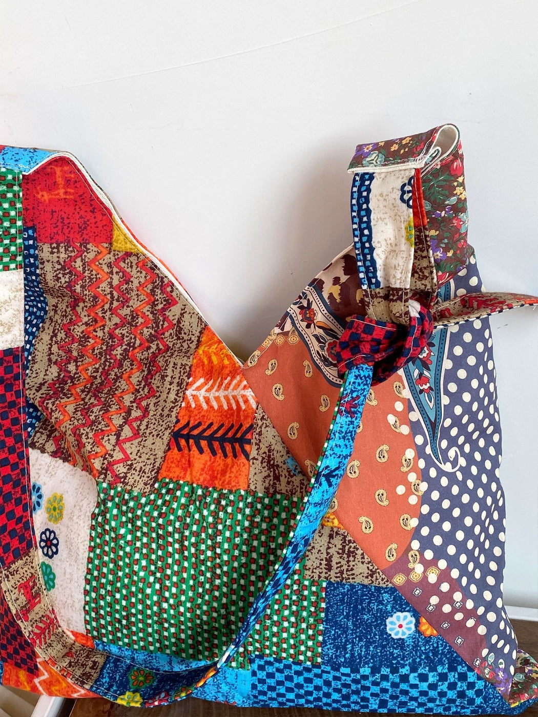 Cosbai boho shoulder bag worn over shoulder on model outdoors