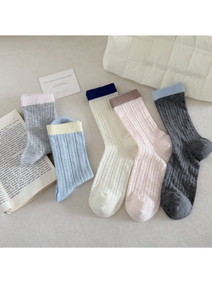 Pair of Rufia soft ribbed colourblock socks in beige, brown, and cream tones