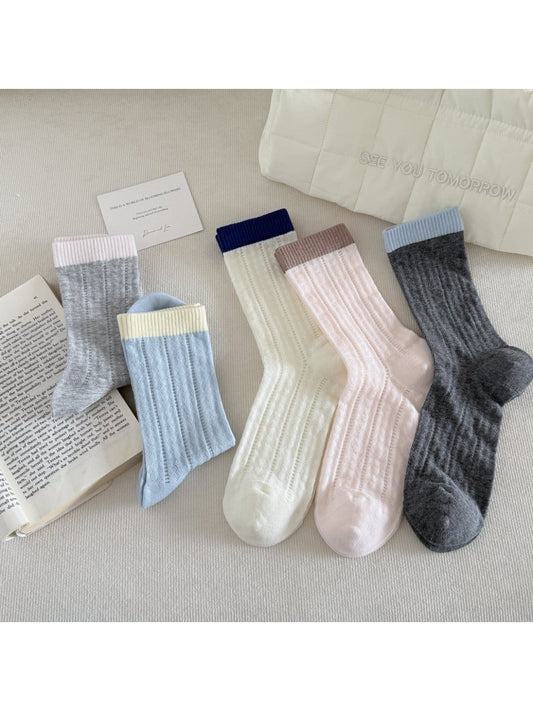 Pair of Rufia soft ribbed colourblock socks in beige, brown, and cream tones