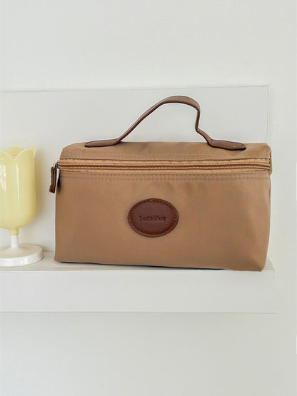 Cosbai travel pouch with cosmetics and brushes inside