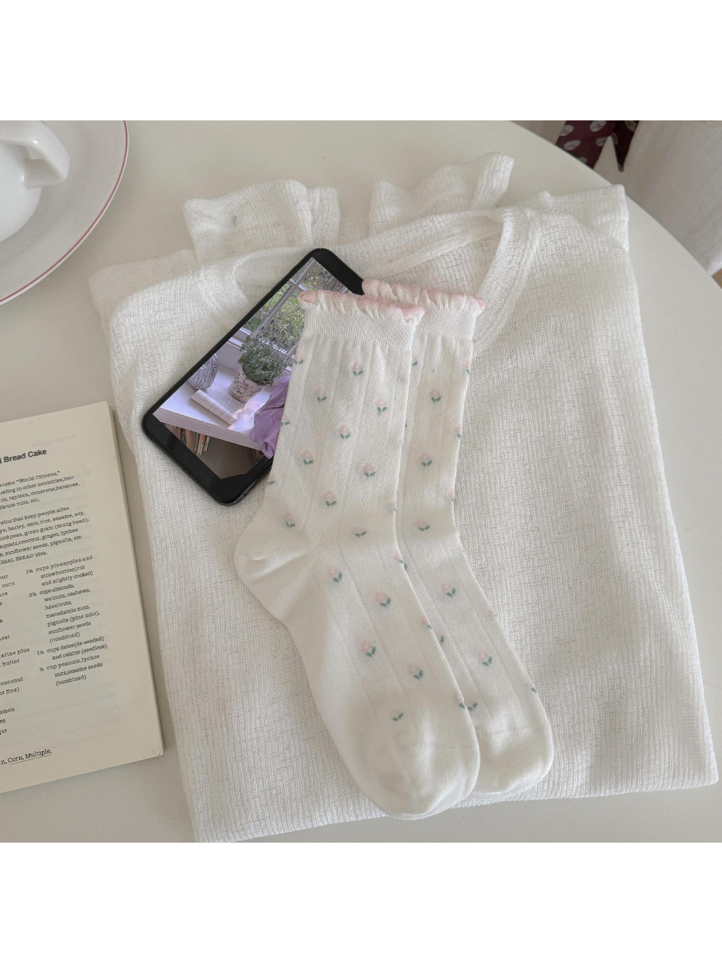 Side view of Rufia Dreamy Pastel Bloom crew socks highlighting ribbed cuff and floral pattern
