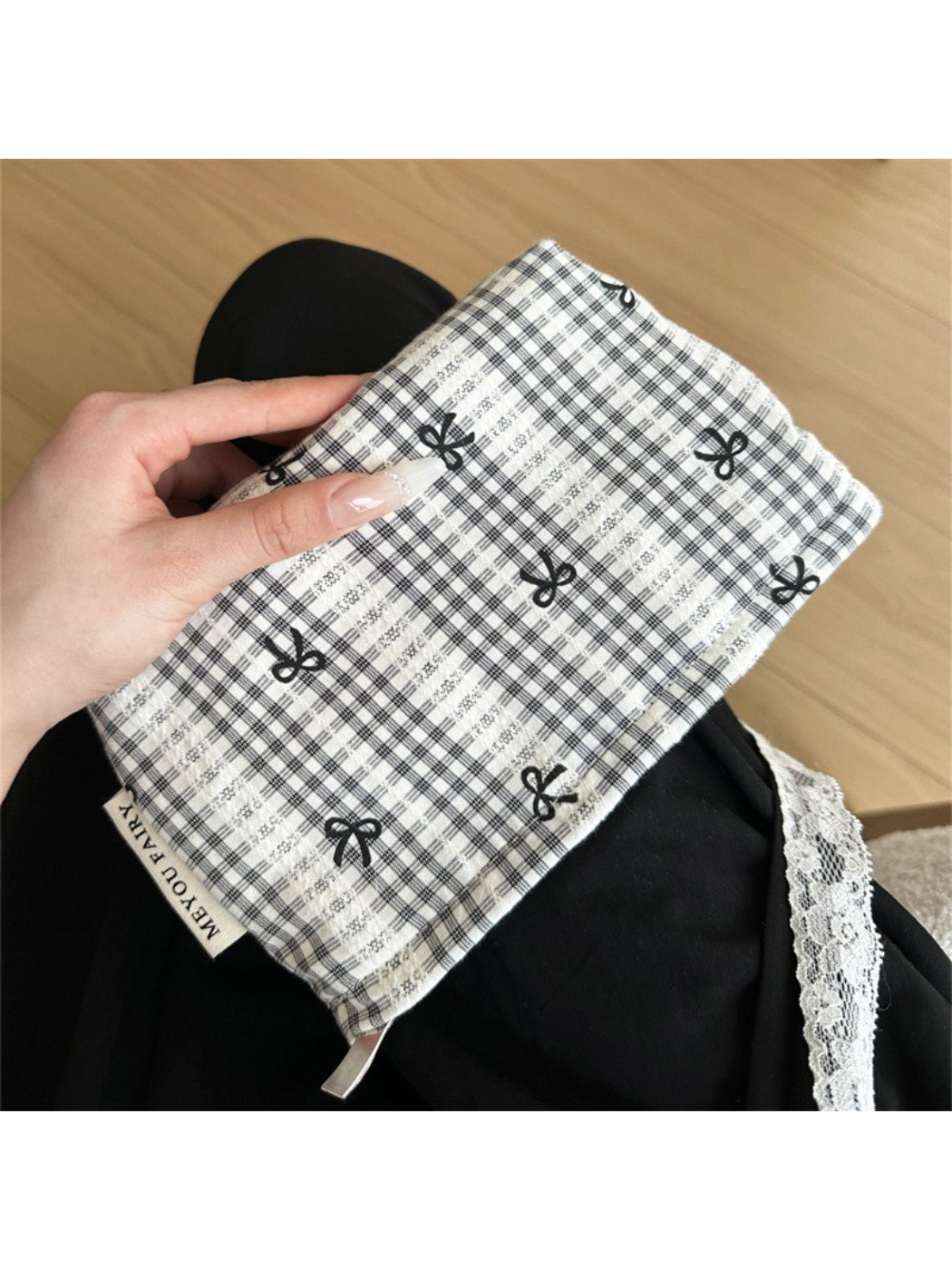 Side view of Cosbai gingham bow makeup pouch in checkered fabric