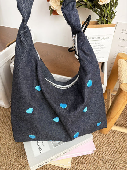 Cosbai slouchy shoulder bag worn on shoulder showing size and fit