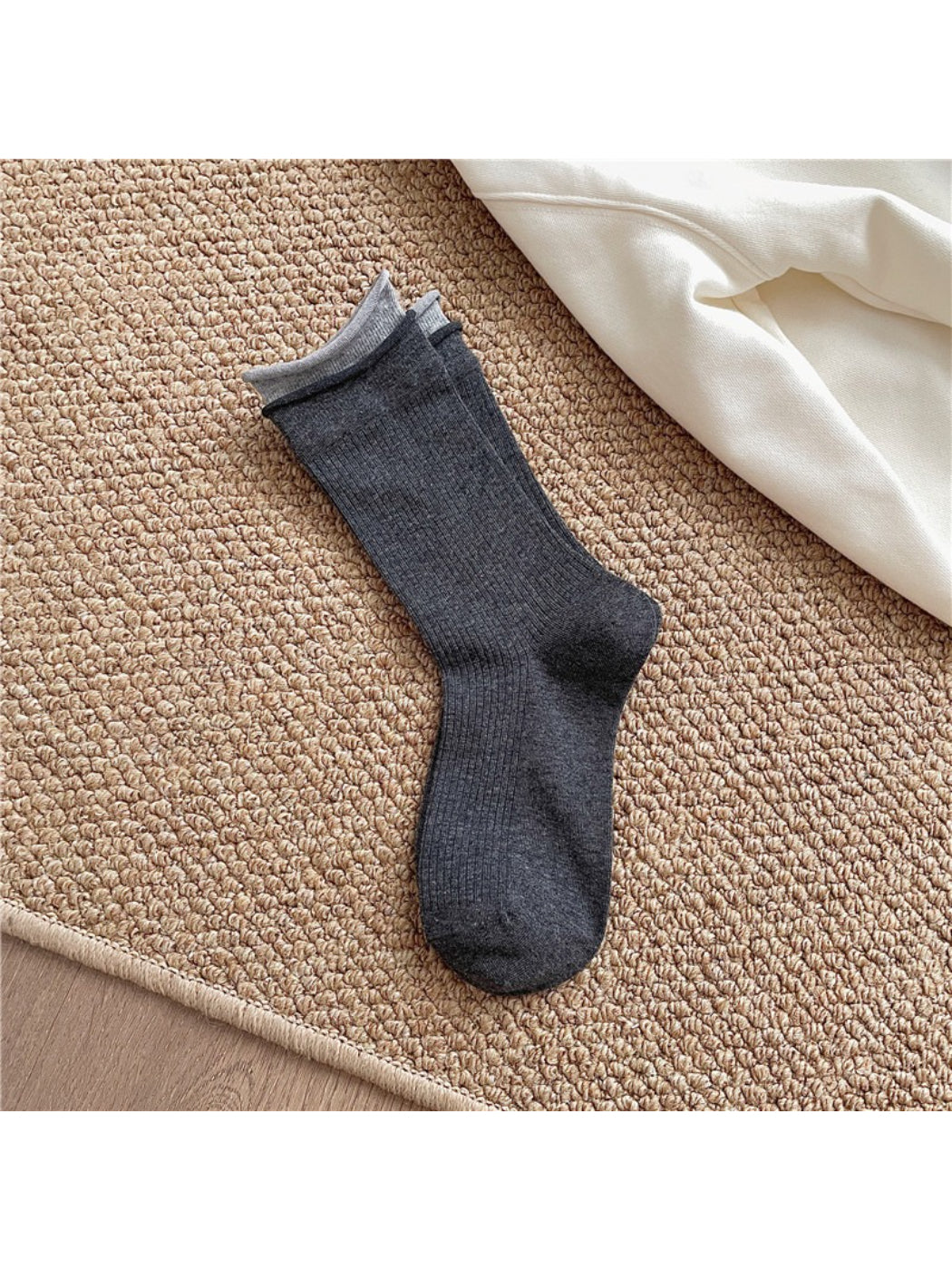 Model wearing Rufia casual roll cuff crew socks with casual shoes