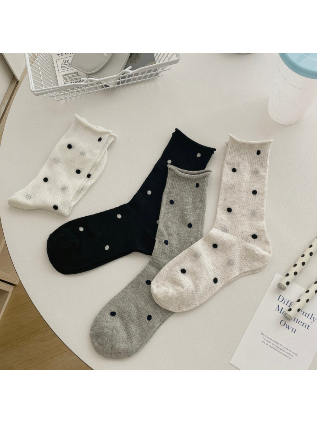 Pair of Rufia textured spot knit socks in beige with ribbed cuffs