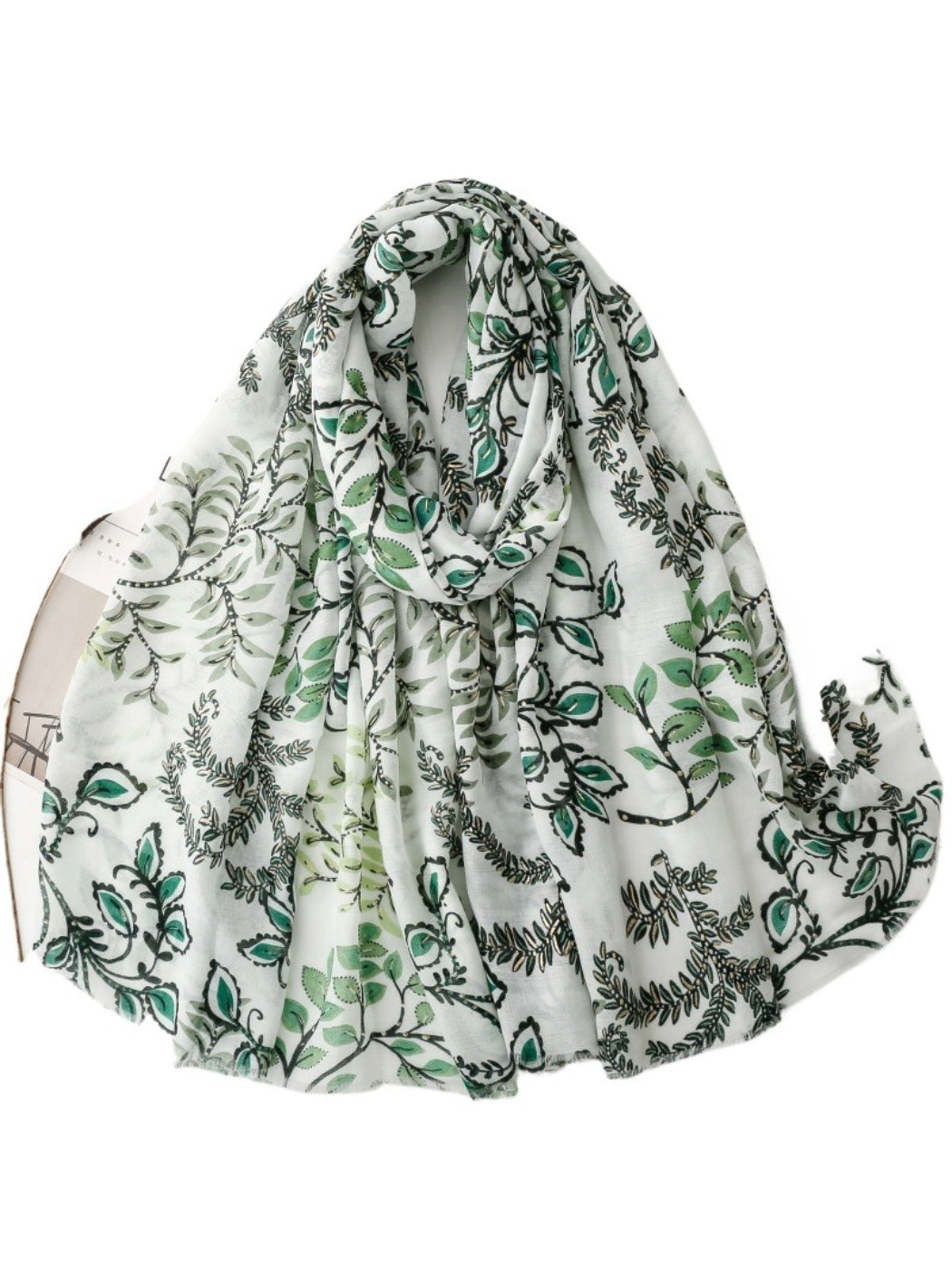 Close-up of Scarvii Botanical Vine scarf fabric texture with detailed green vine print