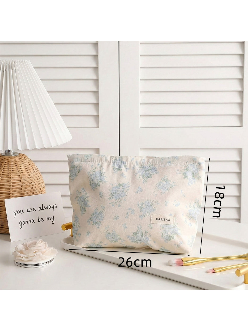 Cosbai lightweight makeup bag with vibrant floral design on fabric surface