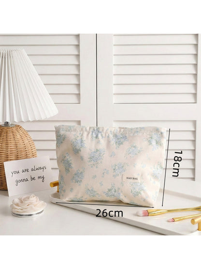 Cosbai lightweight makeup bag with vibrant floral design on fabric surface