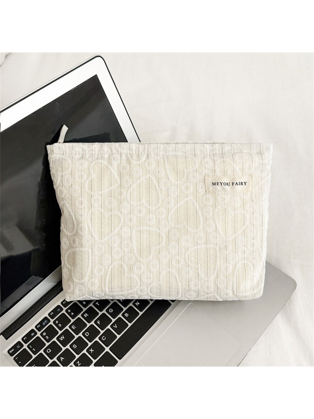Close-up of Cosbai cosmetic bag and heart pattern fabric