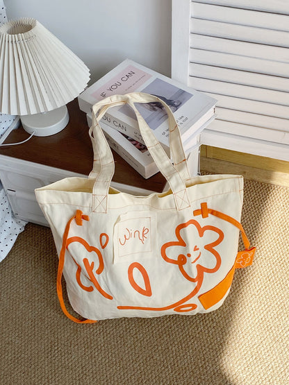 Side view of Cosbai Graphic Everyday Large Tote displaying spacious interior and sturdy handles