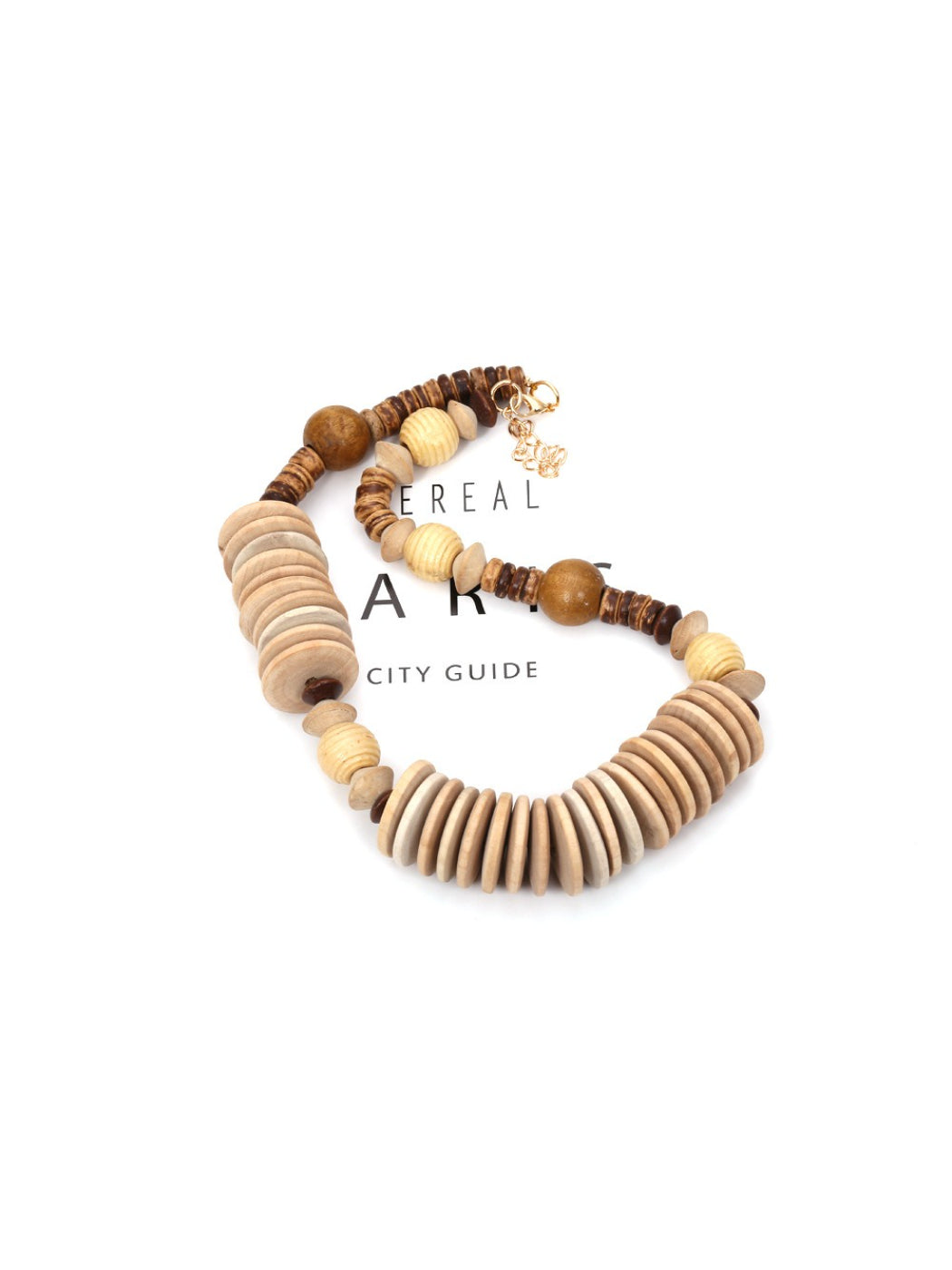Neckit bead necklace displayed coiled to highlight its neutral earthy color palette