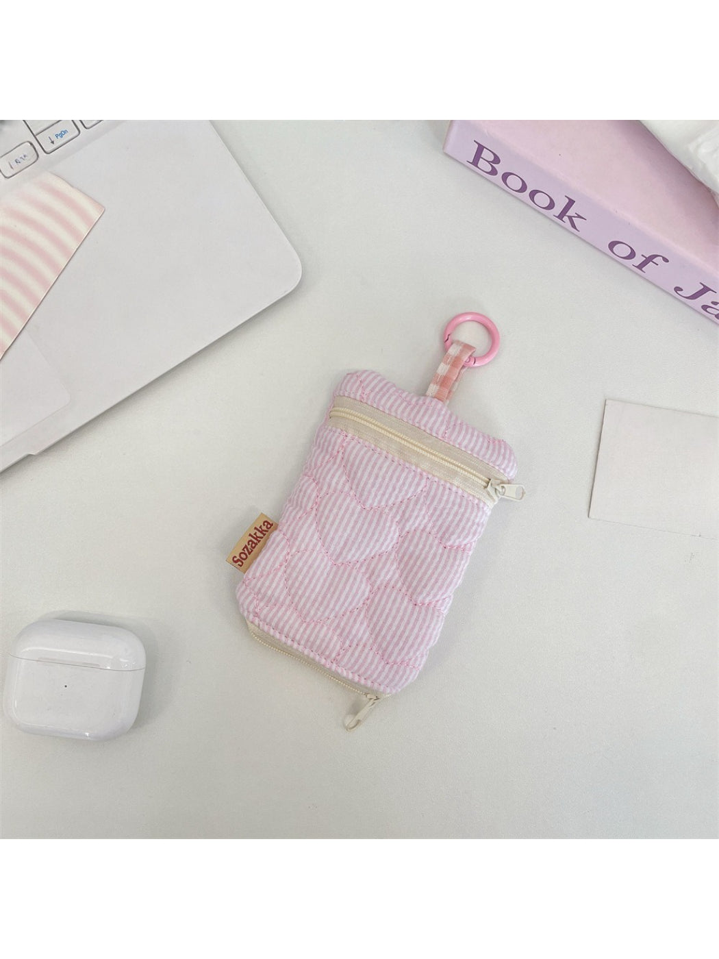 Cosbai Mini Zipper Key Pouch clipped to a belt loop on jeans