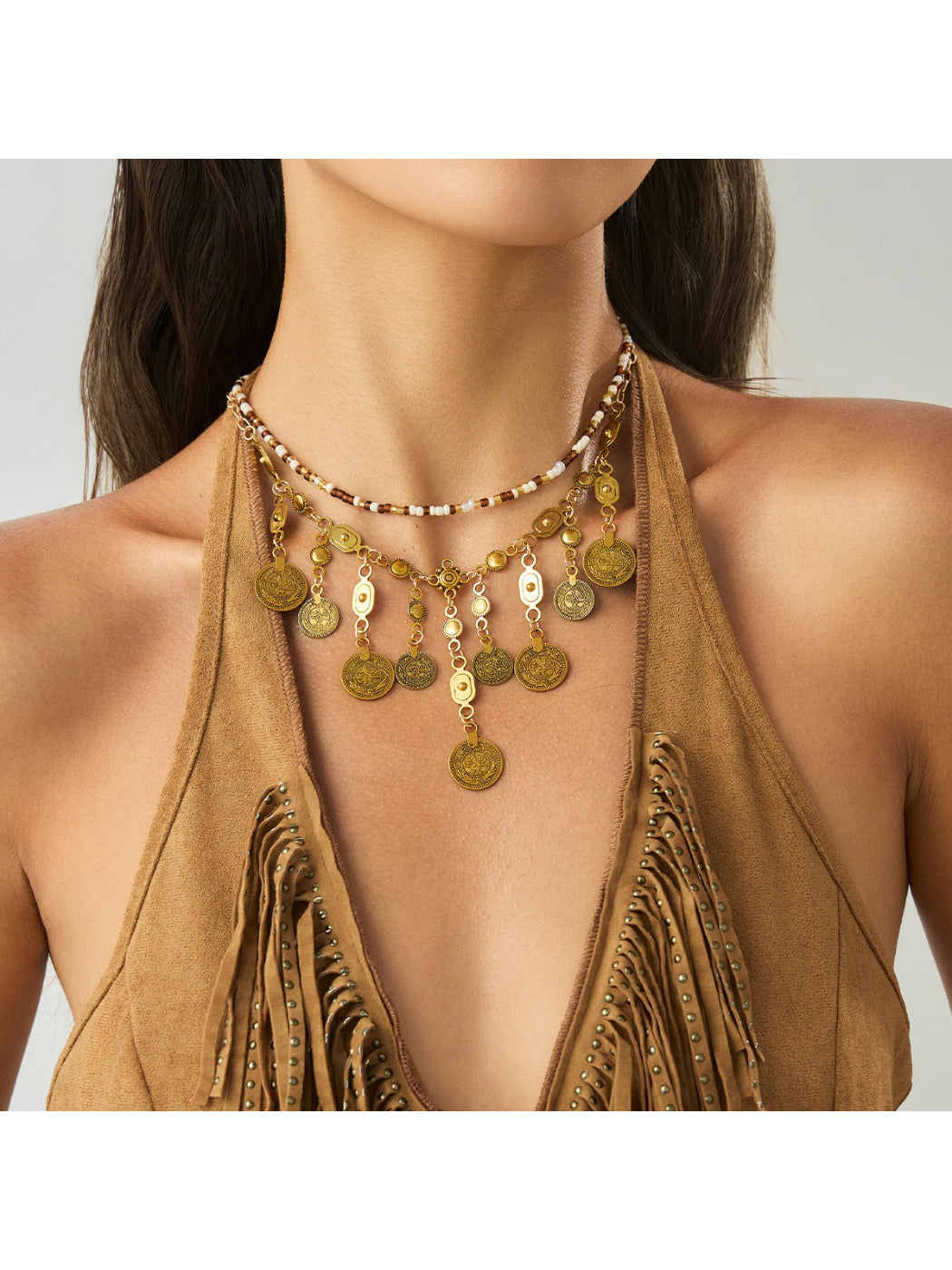 Close-up of Boho coin pendant on a delicate chain necklace