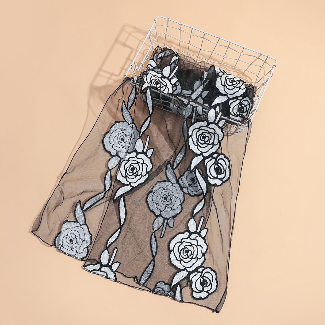 Scarvii sheer rose mesh scarf styled around a model's neck