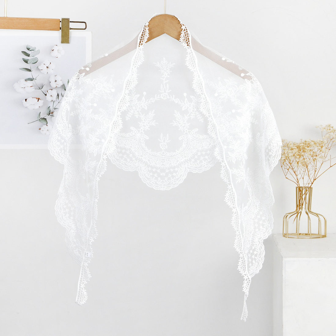 Haila triangle veil scarf styled as a head covering with delicate lace edges