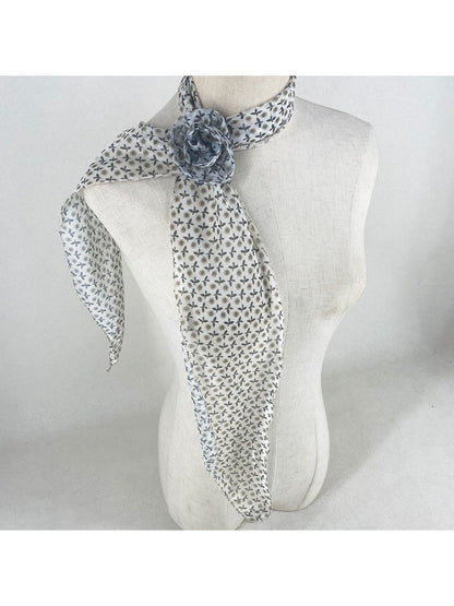 Flat lay of scarf displaying full vintage rose and polka dot pattern