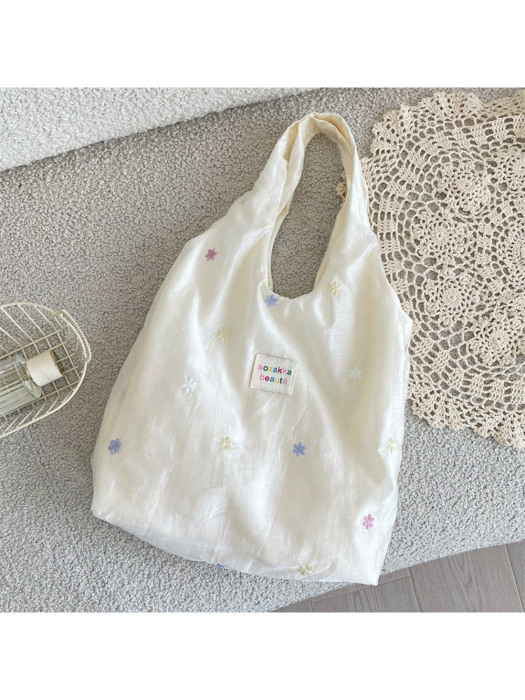Side view of Cosbai Pastel Daisy Slouch Tote Bag showing slouchy shape