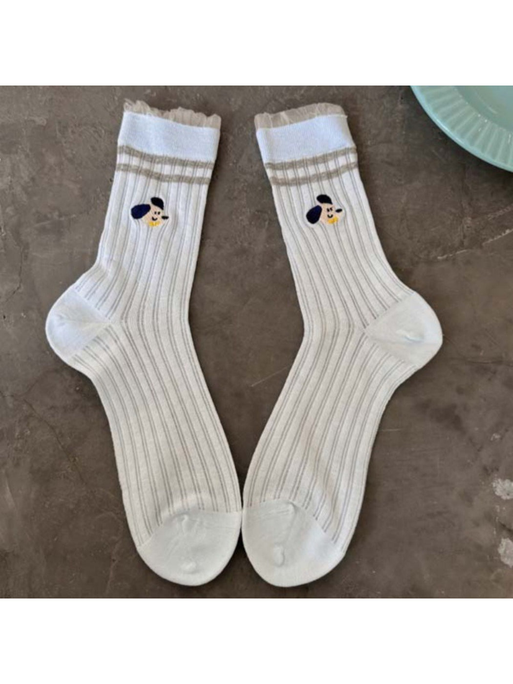 Rufia Playful Pup socks packaging with brand label and colorful dog graphics