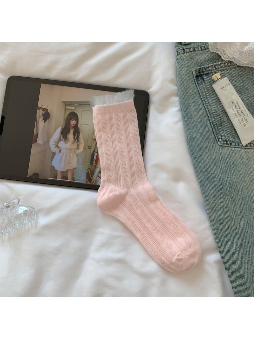 Rufia sheer wave pattern crew socks paired with casual outfit on model