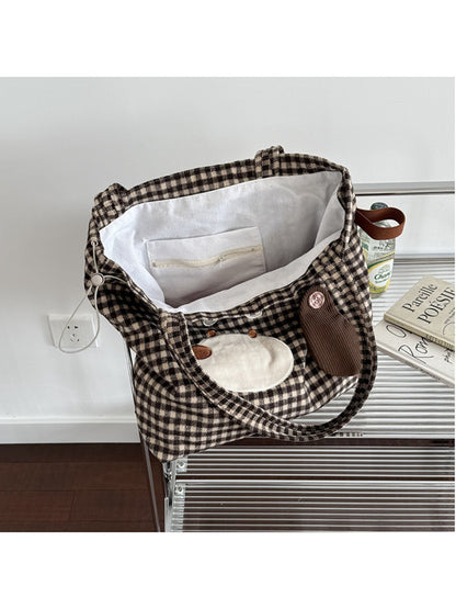 Cosbai Puppy Gingham Drawstring Tote hanging on a hook