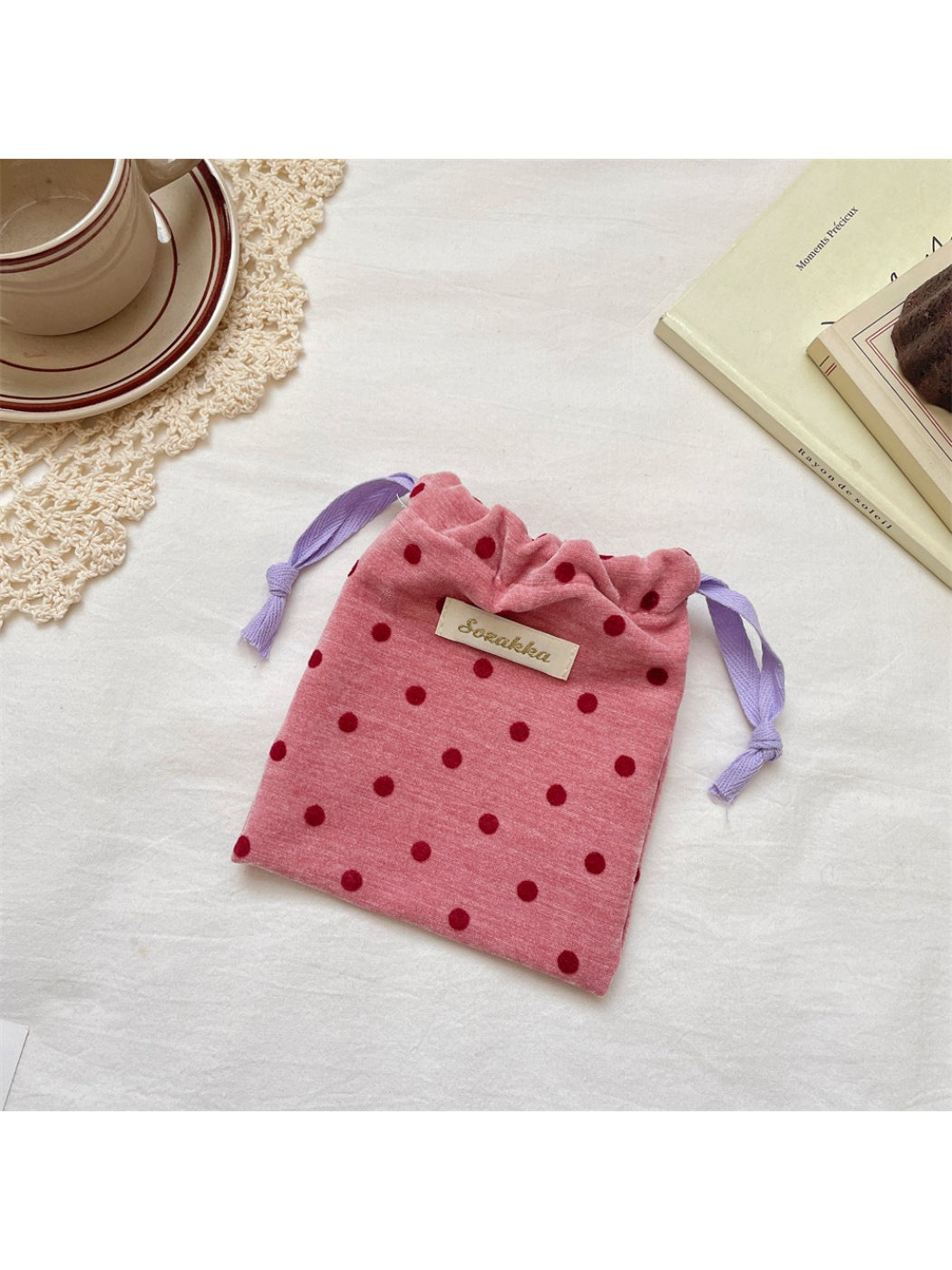 Cosbai velvet pouch open showing spacious interior with polka dot design