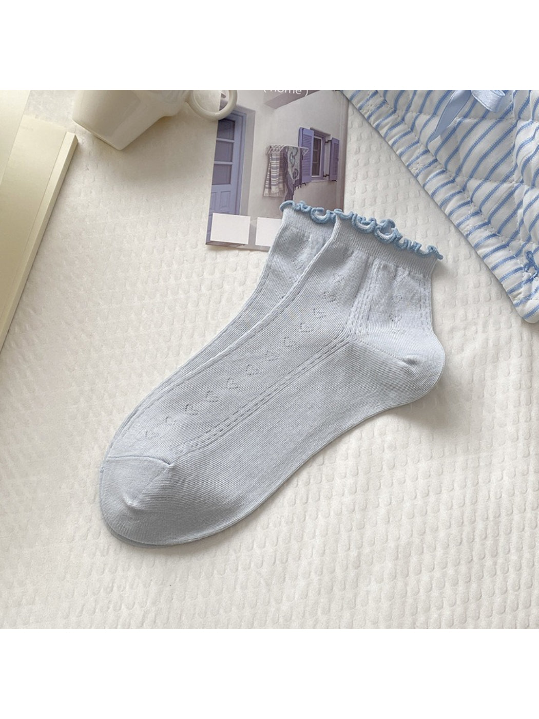 Rufia white crew socks with red edge detail paired with casual shoes