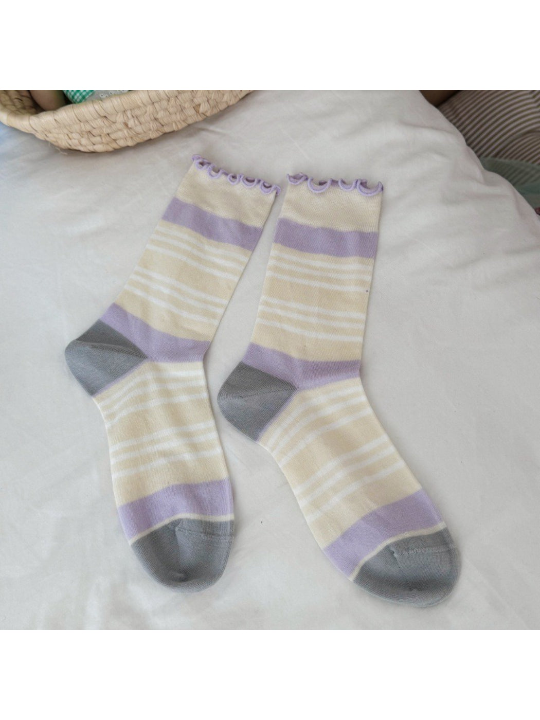 Rufia socks displayed with one sock folded to show the inside texture