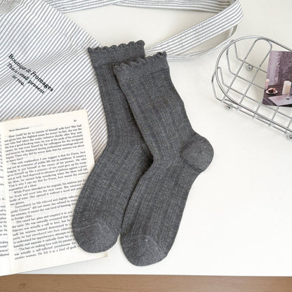 Side view of white crew socks showing ruffle trim detail