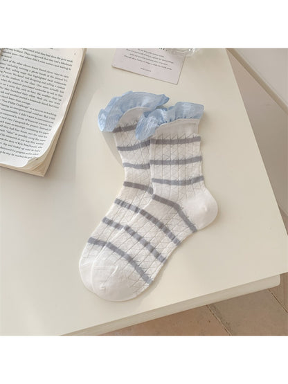 Rufia summer crew socks styled with rolled-up jeans to showcase stripe and frill cuff