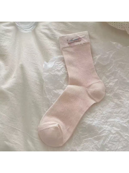 Top view of Rufia Romantic Bow Texture crew socks showing overall texture and bow