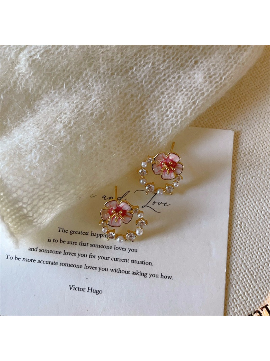 Side view of pink flower earrings showing detailed petals and gold accents