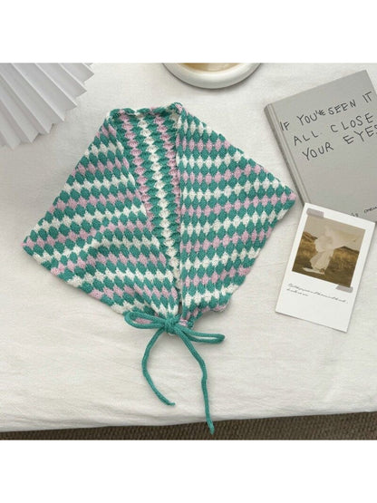 Close-up of scarf knit stitches highlighting diamond shapes