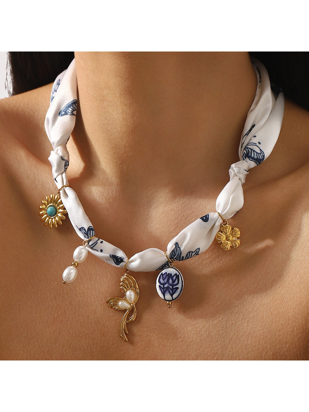 Neckit Botanical Charm fabric necklace displayed coiled on a flat surface