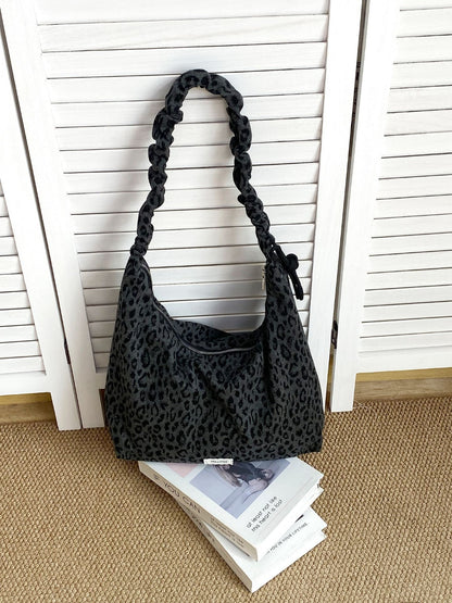 Top view of Cosbai leopard slouchy shoulder bag with open showing interior lining