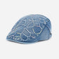 Close-up of Haila washed denim vintage retro newsboy cap fabric and panel details