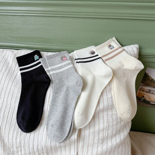 Close-up of Rufia Mini Motif Stripe Crew Socks fabric texture and colorful stripes