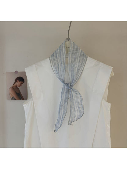 Scarvii skinny scarf styled around a mannequin neck showing gingham and stripe design